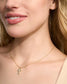 KENDRA SCOTT Cross Gold Pendant Necklace in White Kyocera Opal